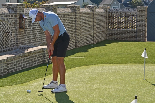 Pittsburgh Golfer putting on synthetic grass